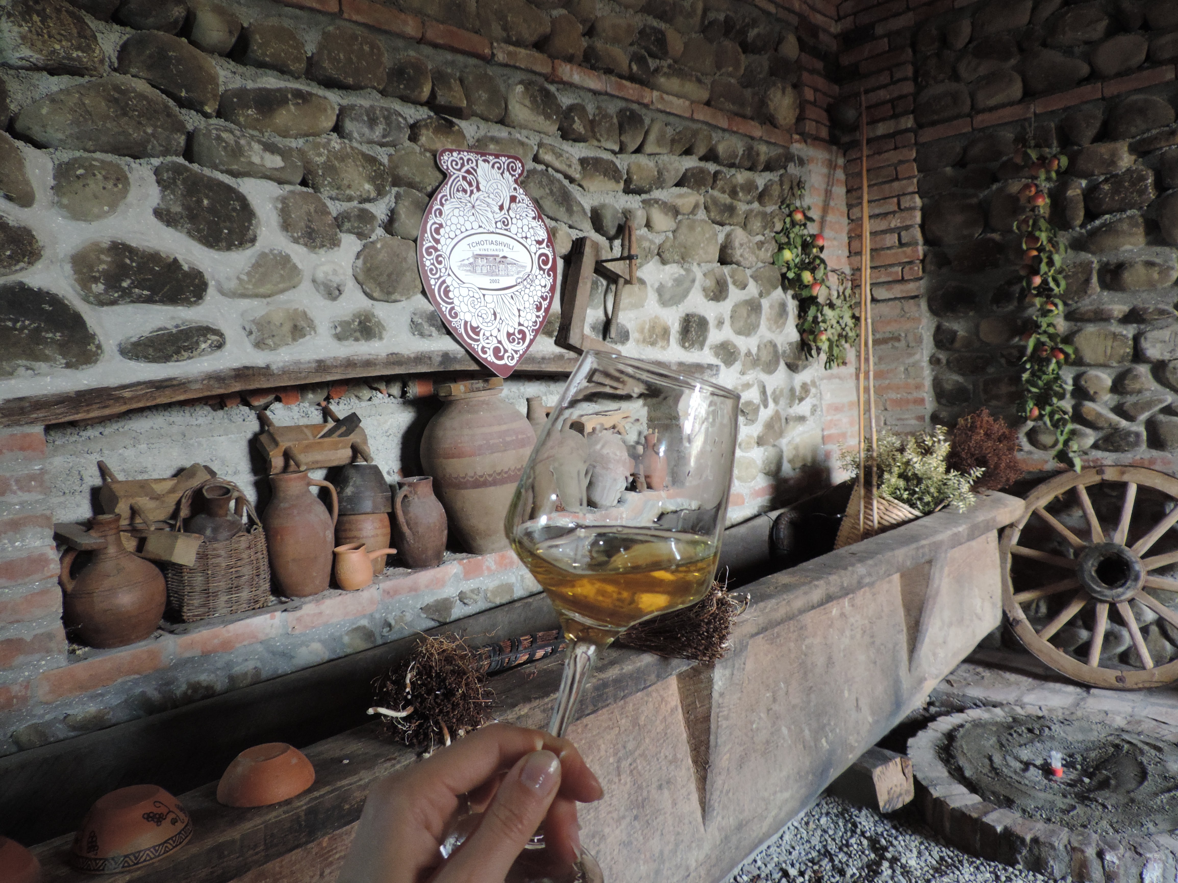A glass of wine at a traditional Georgian wine cellar